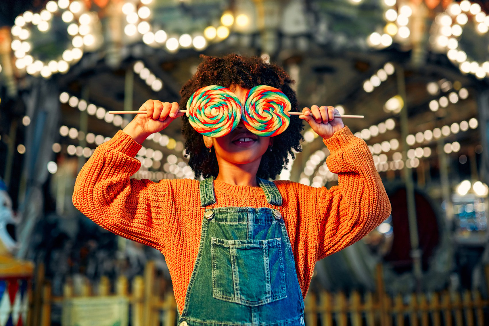 Kids having fun on a carnival Carousel